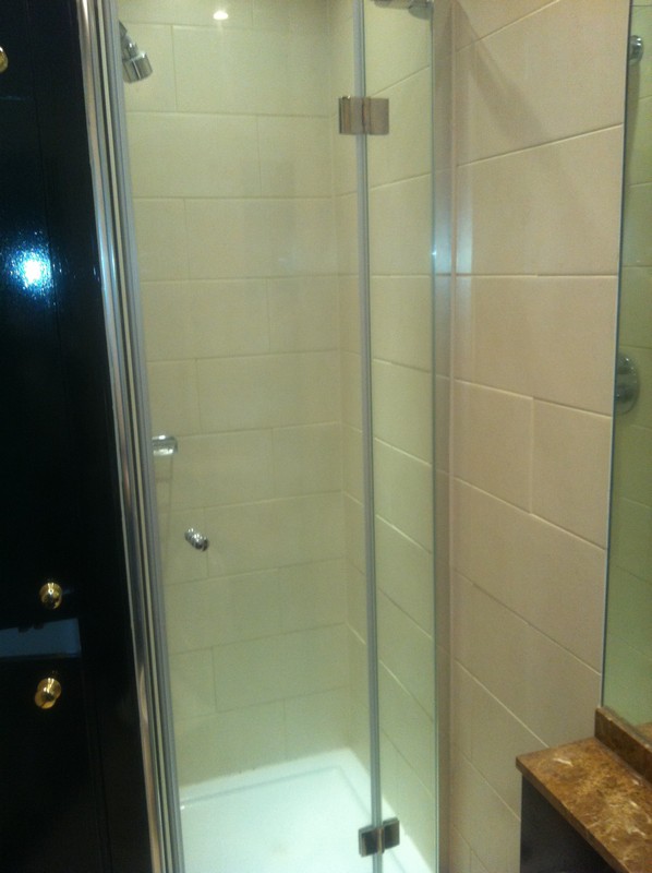Frameless glass shower enclosure with chrome fittings in Mill Hill
