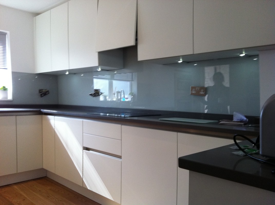 Grey glass kitchen splashback with LED lighting in Mill Hill