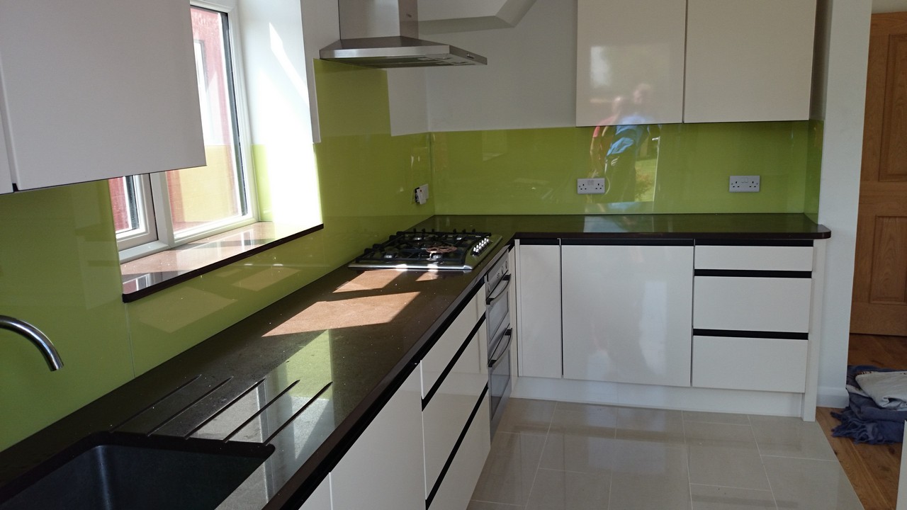Lime green glass kitchen splashback installed by Mill Hill glaziers