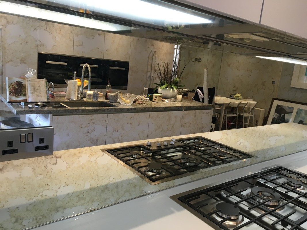 Mirror glass splashback in Mill Hill luxury kitchen