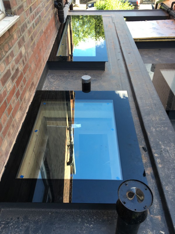 Multiple flat roof skylights on extension in Mill Hill